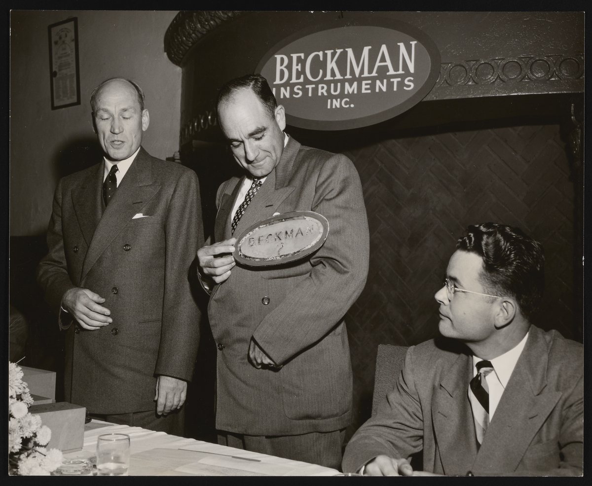 Arnold O. Beckman and unidentified men at a Beckman Instruments ...