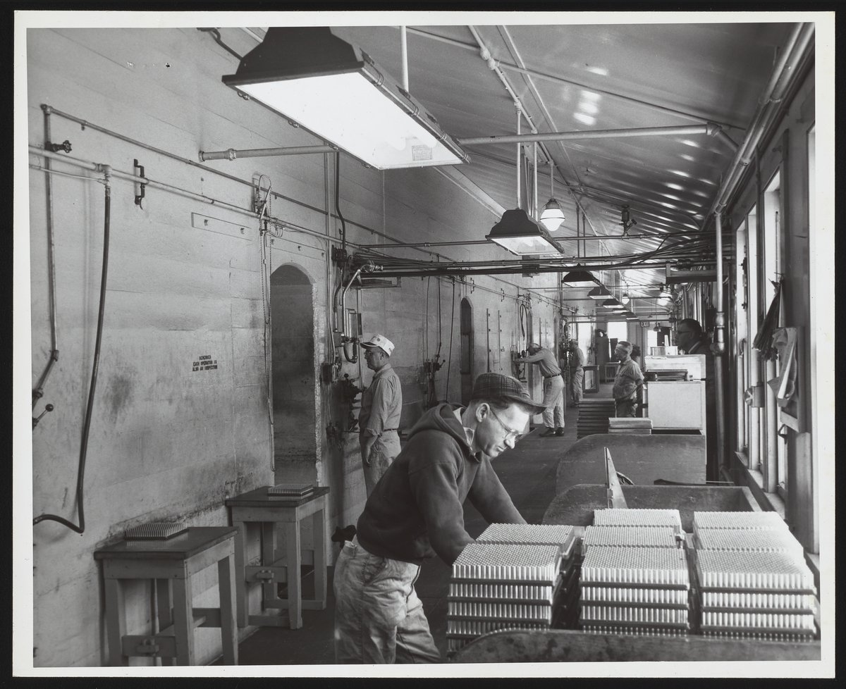 Employees at work on automatic loading line at Hercules Port Ewen plant